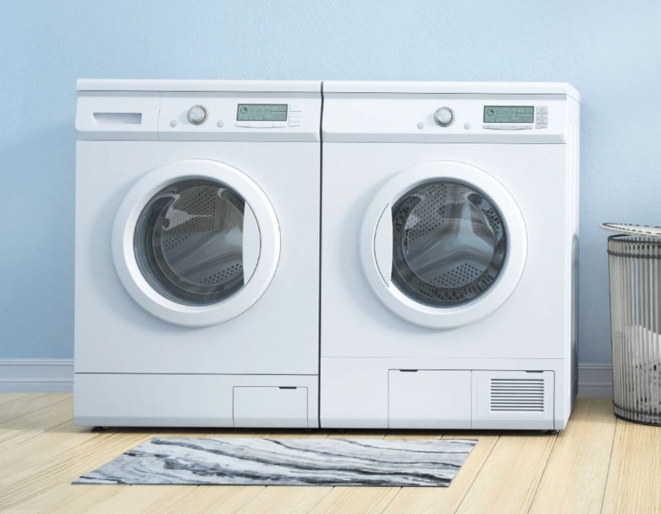 Shiny new smart washing & drying machines in a bright modern home.