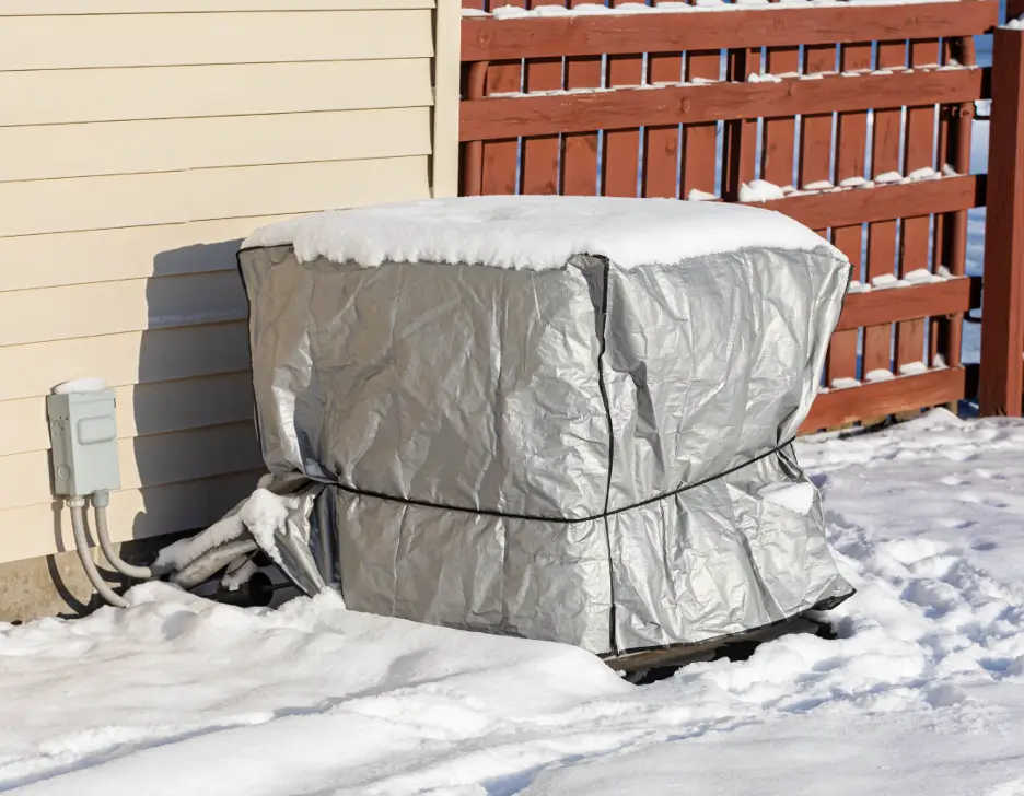 HVAC wrapped in a tarp for the winter.