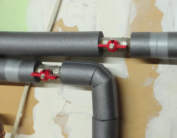 Insulation wrapped around a pipe.