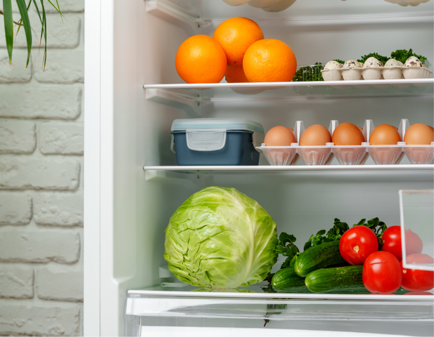 Fridge stocked full of fresh produce.
